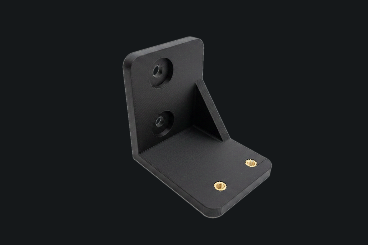 Structural L-bracket with heat-set inserts